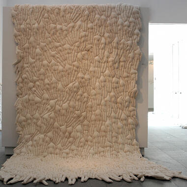 Cheryle Melander, She Covers, 2005, muslin, silk thread, and polyfill Dimensions: 2”x 188”x 86”