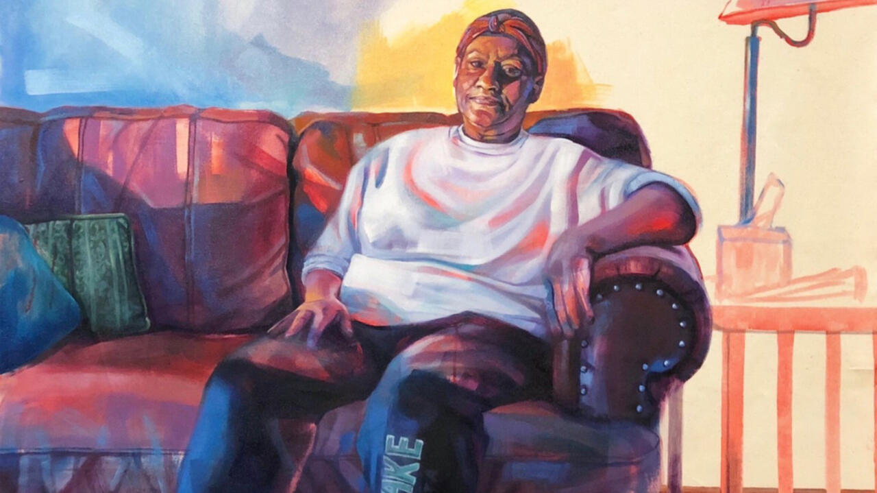 A painting of a dark skinned woman sitting on a red couch, the woman's arm is propped up on the couch and next to her is a lamp. The painting is colorful