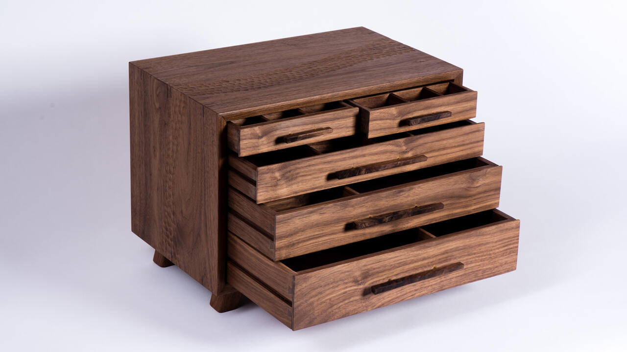 A wooden box with pullout shelves