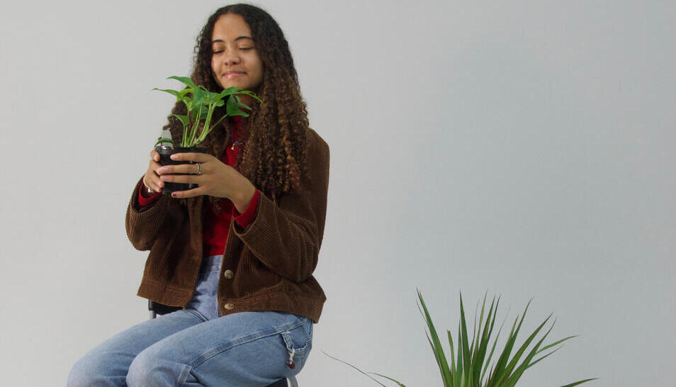 Portrait of Makayla with plants