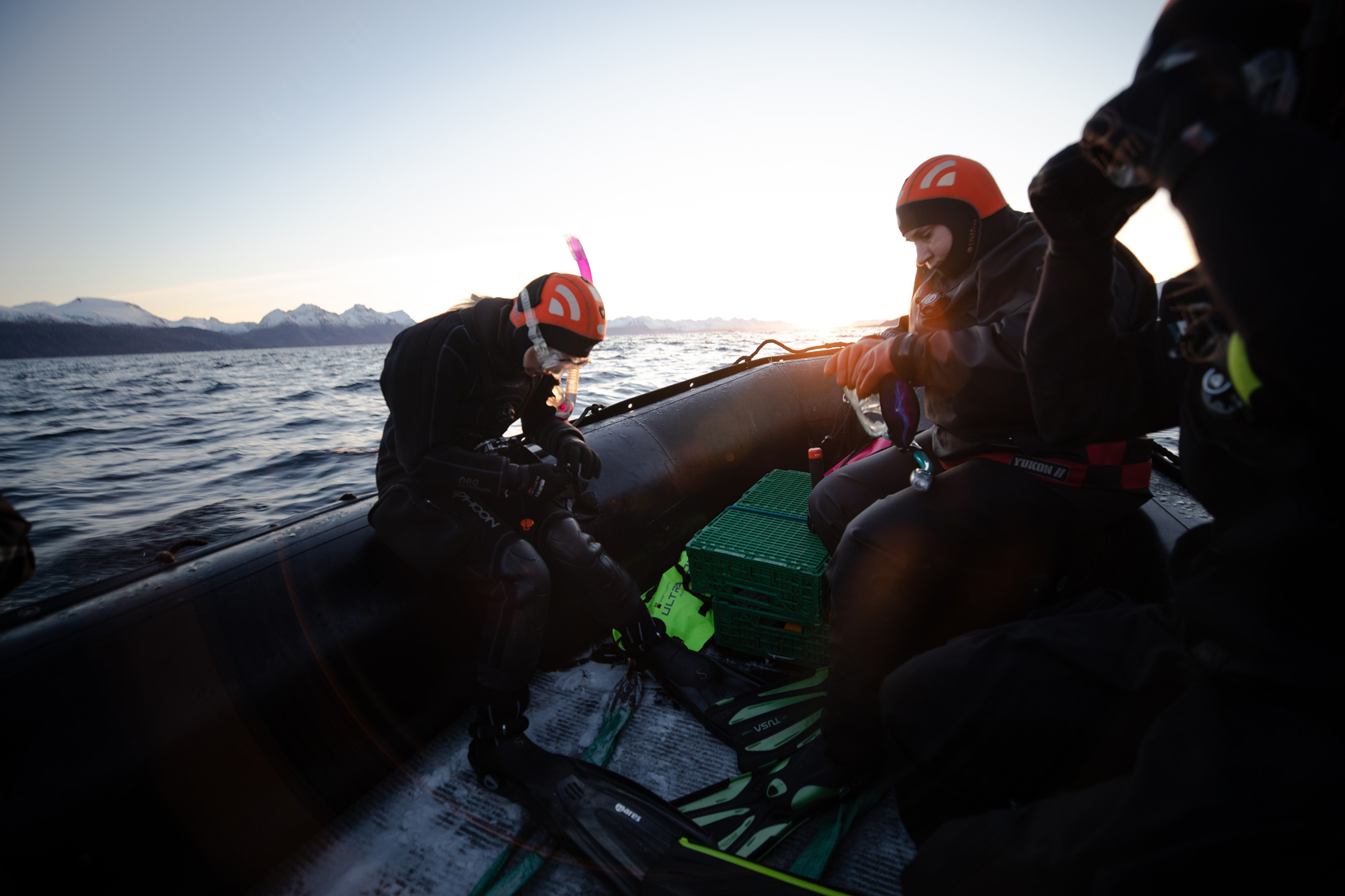 Divers getting prepared on boat