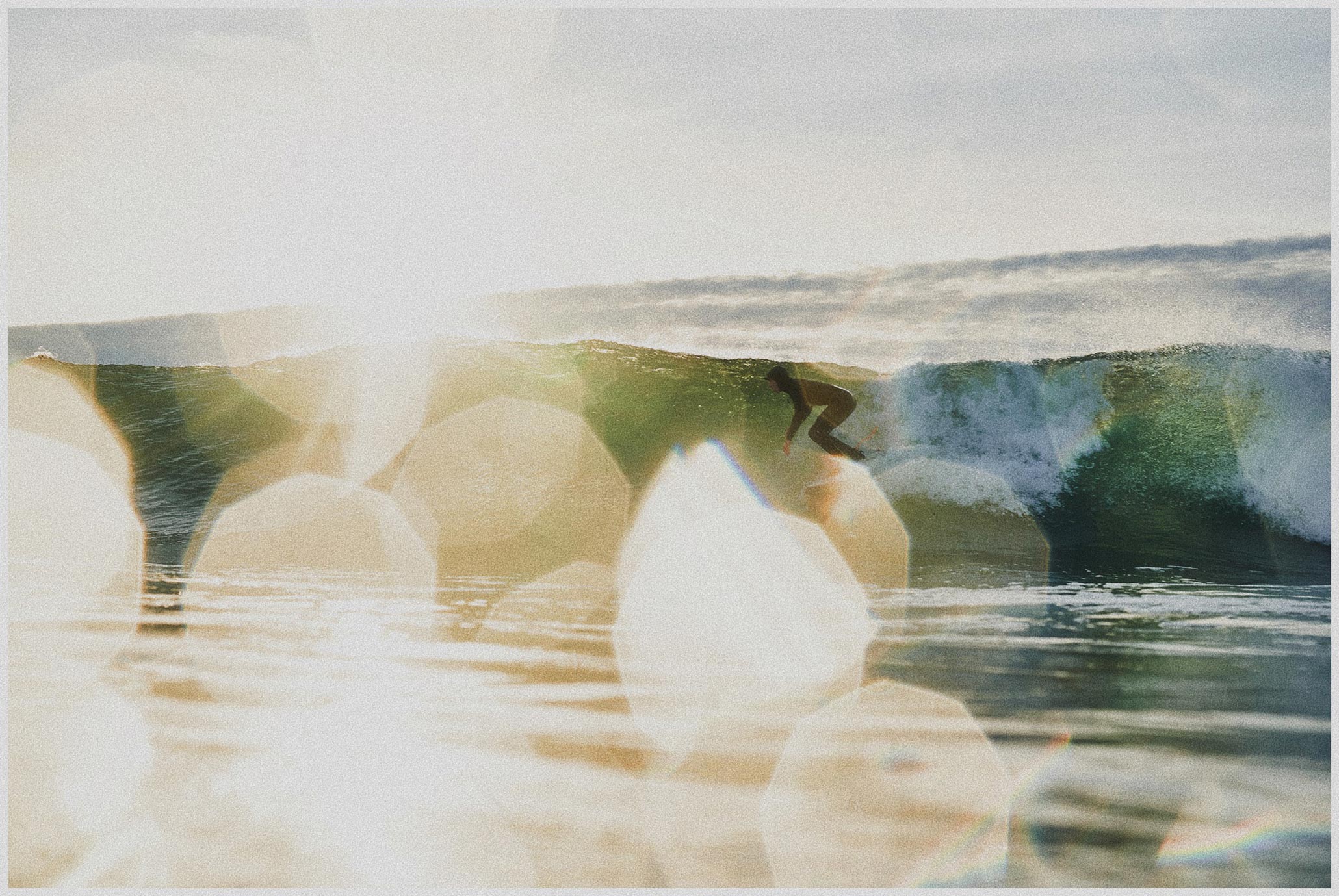 Photograph of a surfer in the sunlight by Kyle Lieberman.