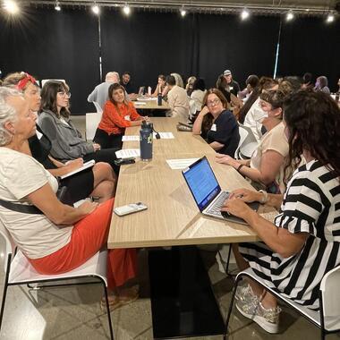 MCAD creative leaders sitting around a table