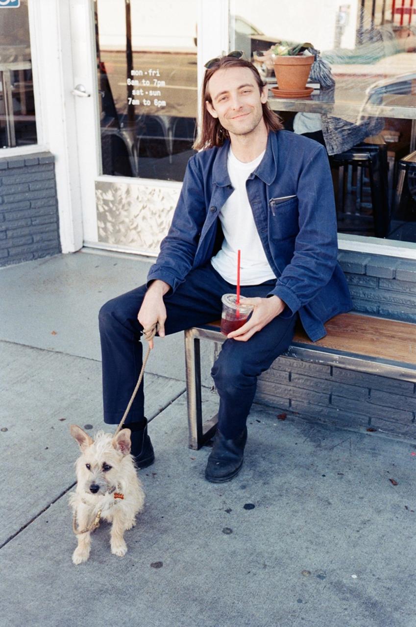 Portrait of Parker Sprout and dog.