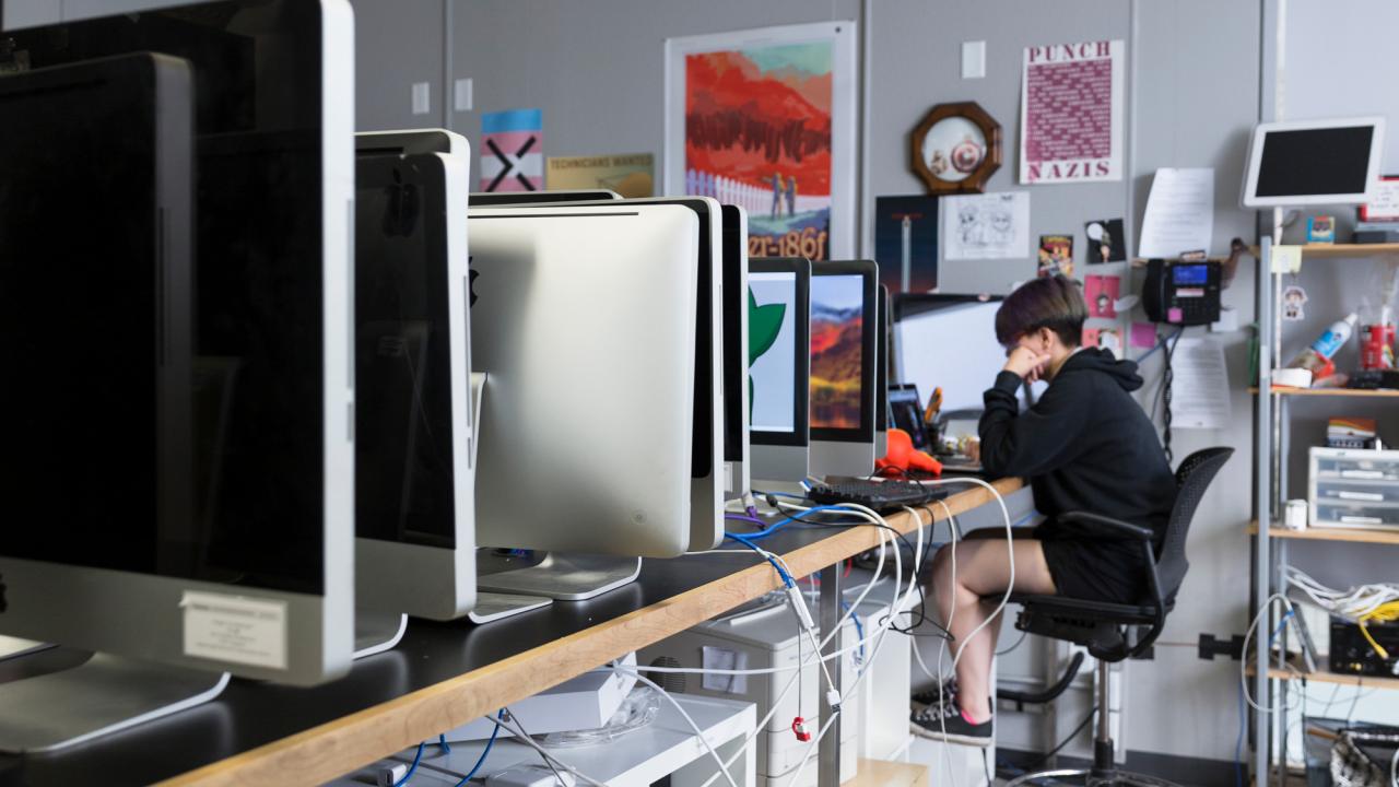 Person at desk working on computer