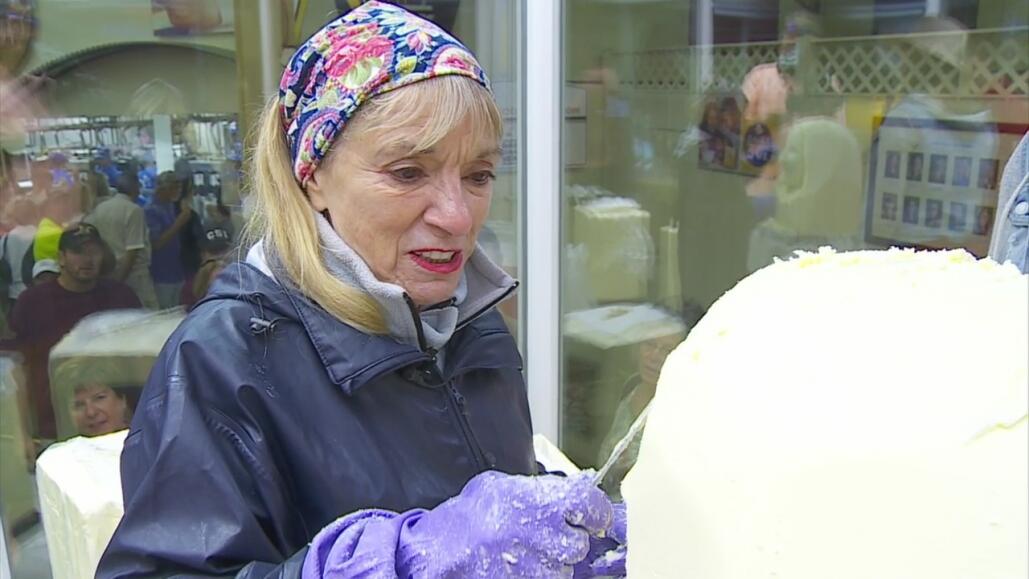 Portrait of Linda Christensen carving butter