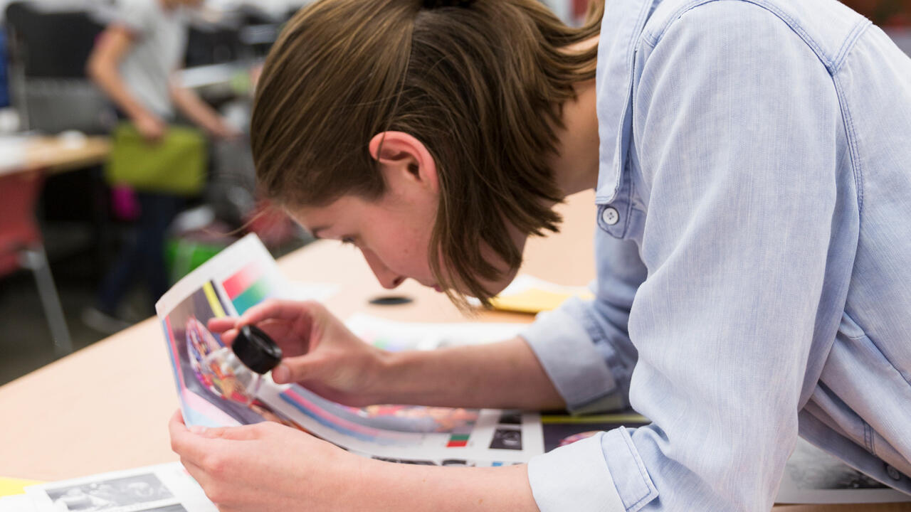 Person looking at print color up close