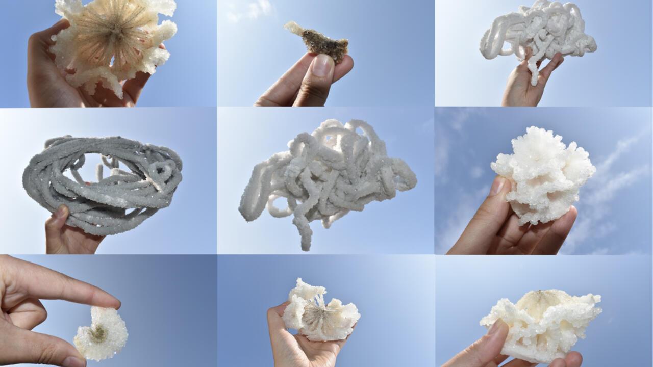 Nine photographs of different hands holding white crystals against the sky