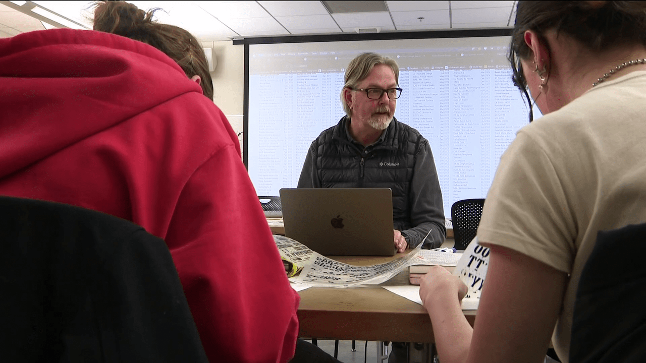 An image of Erik Brandt among MCAD students in class.