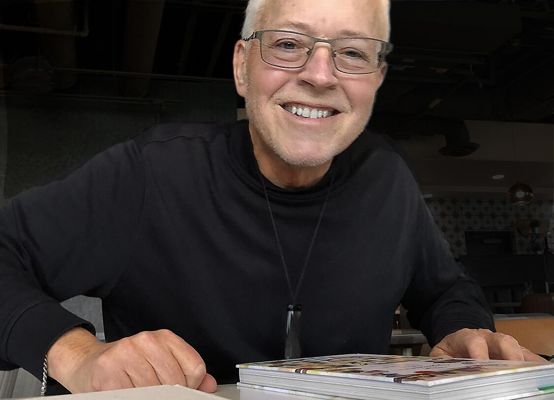 Portrait of Professor Emeritus, man smiling toward camera