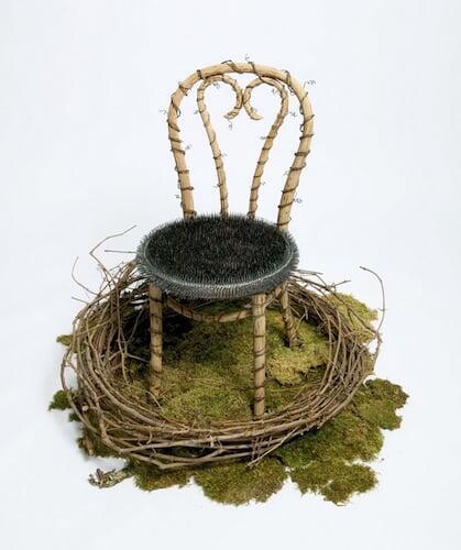 Jill Waterhouse, Out of the Earth Like Iron II, 2004, French cafe, chair, blue-steel carpet tacks, vintage barbed wire, grapevines, forest moss, approximately 40 in. x 42 in. x 41 in. 