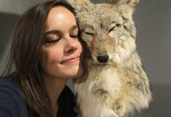 Maggie Falco in front of a faux fox sculpture